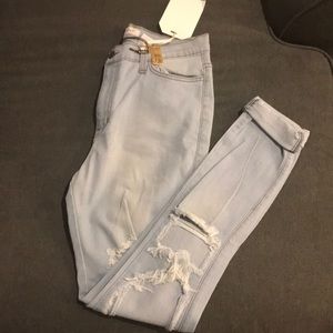 Never worn Super distress cuffed jeans